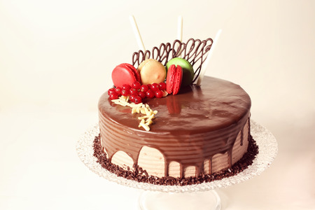 Chocolate cake decorated with macaroons