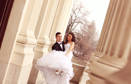 Bride and groom having funの写真素材