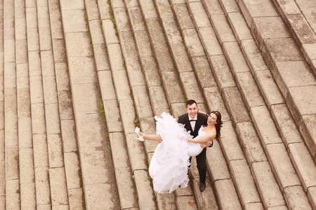 Bride and groom on stairsの写真素材