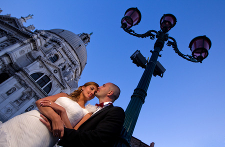Lovely bride and groom in the city sunny day flower bouquetの写真素材