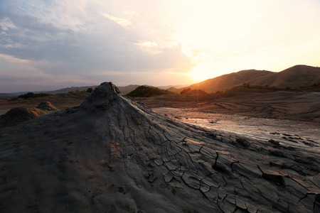 Beautiful sunset at mud volcanos in Buzau, Romania