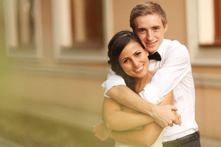 Happy bridal couple embracingの写真素材