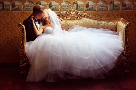 Beautiful bridal couple kissingの写真素材