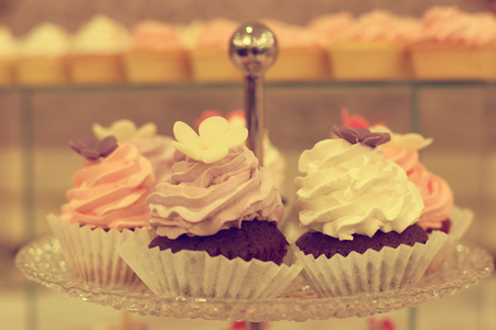 Delicious cupcakes on standの写真素材