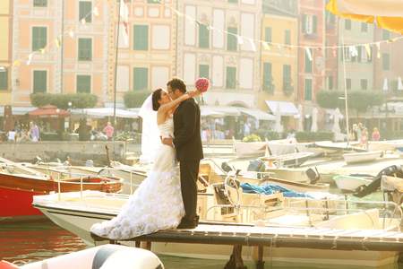 Bride and groom near port with cityscapeの写真素材