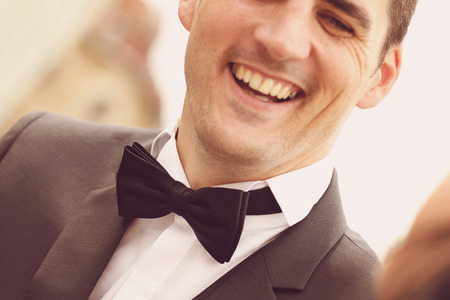 Close up with happy groom smilingの写真素材