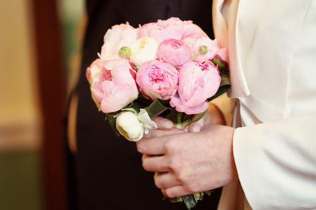 Beautiful flower bouquet in hands of a womenの写真素材