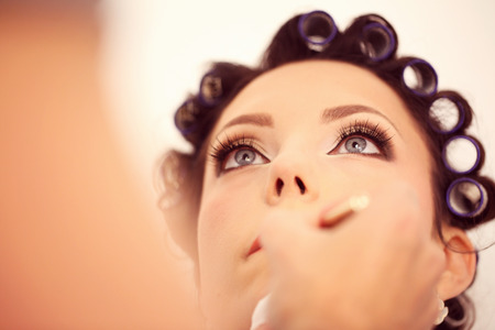 Beautiful bride with professional make up before weddingの写真素材