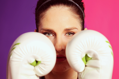 Portrait of a female boxer with glovesの写真素材