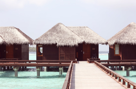 Water villas on tropical caribbean island in Maldivesの写真素材