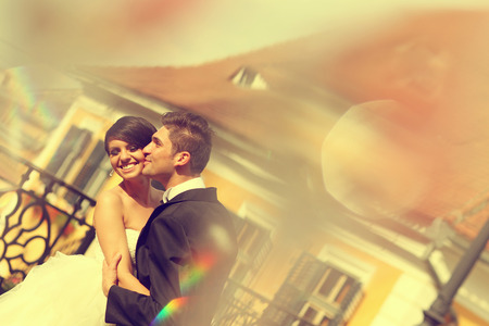 Beautiful bride and groom celebrating wedding day in the cityの写真素材