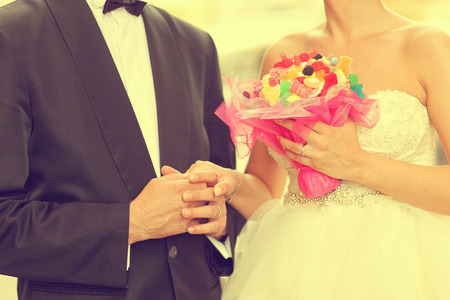 Beautiful bride and groom celebrating wedding day in the cityの写真素材