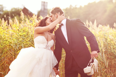 Beautiful bride and groom celebrating wedding day in the cityの写真素材
