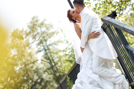 Beautiful bride and groom celebrating their wedding day in the cityの写真素材