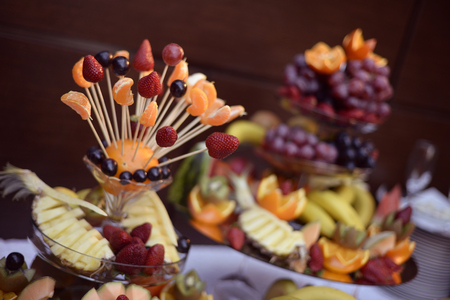 Many delicious fruits on a stickの写真素材