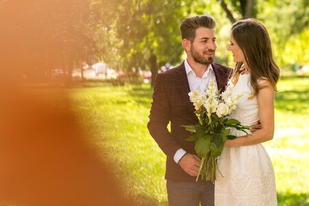 Couple in love on engagement day in natural park.のeditorial素材