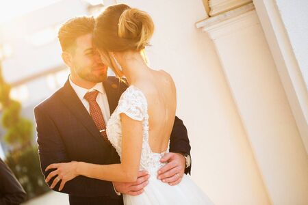Beautiful wedding couple posing outdoor in sunのeditorial素材