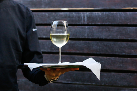 Man Holding one Glassesの写真素材