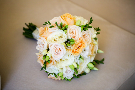 Close up with beautiful bouquet of flowers and ringsの写真素材