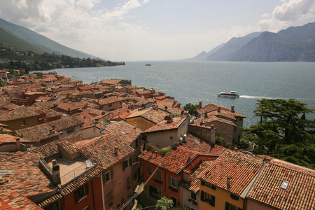 Beautiful view of old houses roofs near sea and mountainsの写真素材