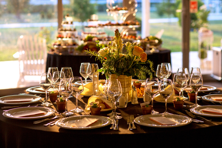 Wedding decorations. Decoration of the hall, restaurant. Black tablecloth on Round table.の写真素材
