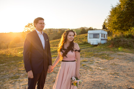 Beautiful wedding couple posing in nature;の写真素材