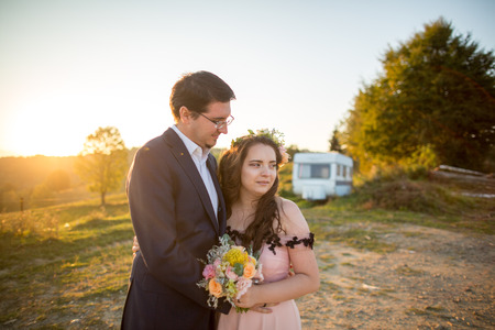 Beautiful wedding couple posing in nature;の写真素材
