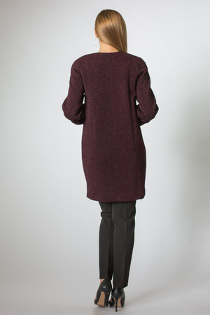 Blonde model posing in coat and black pantの写真素材