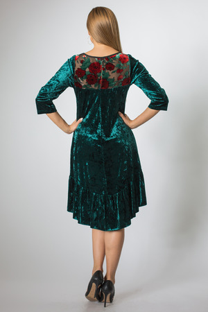 Beautiful caucasian girl posing in green dressの写真素材