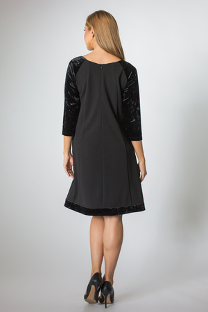 Blonde girl posing in black dressの写真素材
