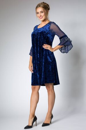 Beautiful girl posing in blue dressの写真素材