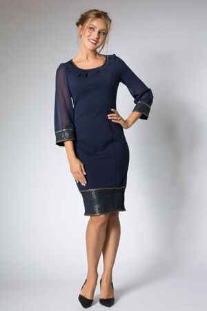 Beautiful girl posing in blue dressの写真素材
