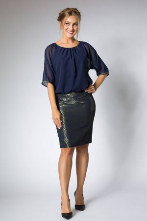 Beautiful girl posing in blue dressの写真素材