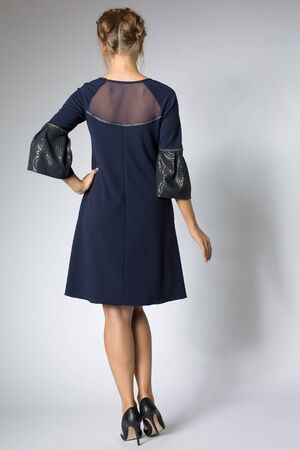 Beautiful girl posing in blue dressの写真素材
