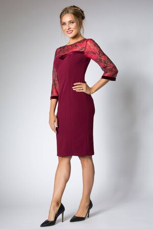 Beautiful model posing in fashion red dressの写真素材