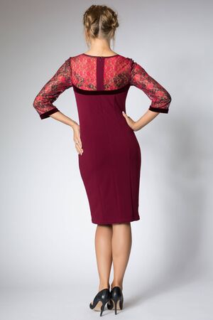 Beautiful model posing in fashion red dressの写真素材
