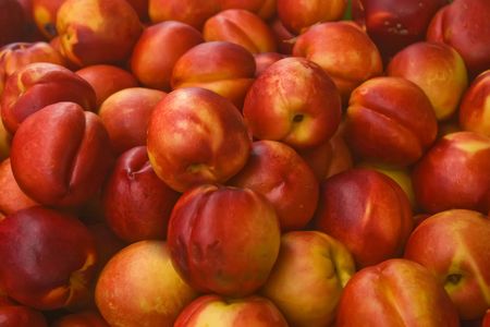 A bunch of nectarines at an outdoor marketの写真素材