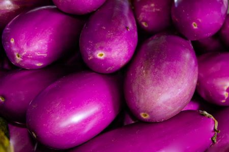 A group of eggplant at an outdoor marketの写真素材