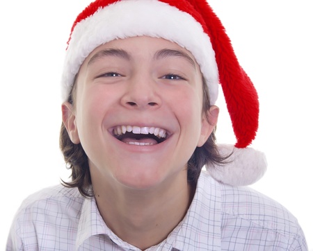 Handsome teenage boy with big smile wearing Christmas hat の写真素材