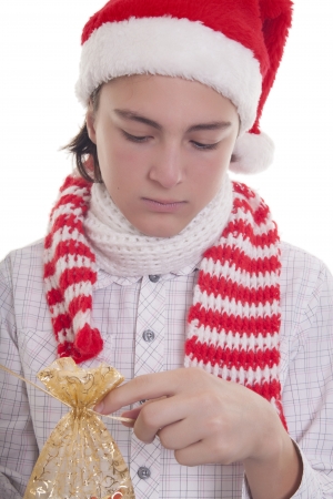 Handsome teenage boy with Christmas hat preparing his presentの写真素材