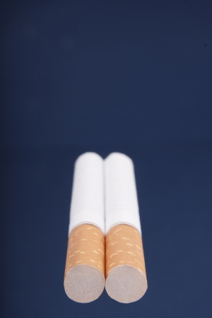 Two cigarettes on a blue backgroundの写真素材