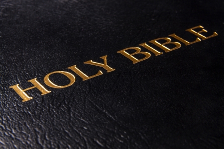 Black leather bible cover written with golden lettersの写真素材