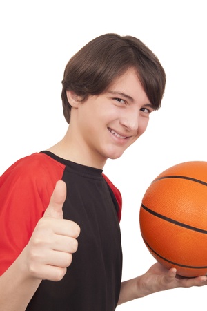 Portrait of a handsome smiling basketball player showing thumb up on white background
の写真素材