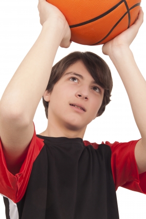Basketball player throwing a basketball on white background
の写真素材