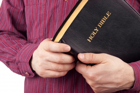 Man Holding a Bible isolated on white
