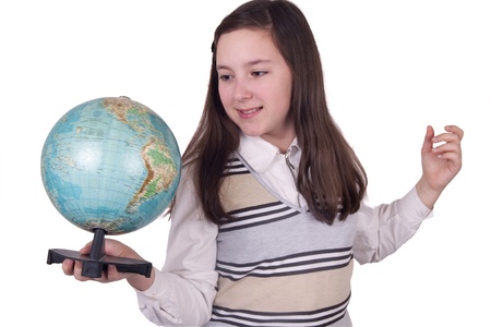 Happy school girl holding globe isolated on white backgroundの写真素材