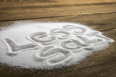 LESS SALT written on a heap of salt - antihypertensive campaignの写真素材
