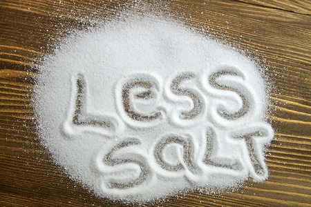 LESS SALT written on a heap of salt - antihypertensive campaignの写真素材