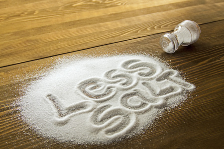 LESS SALT written on a heap of salt - antihypertensive campaignの写真素材