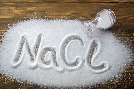 NaCl written on a heap of salt - Sodium Chlorideの写真素材